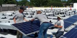 Workers install solar panels on the roof of Immaculate Conception Catholic Church in Hampton, Virginia. (Courtesy of Fr. John Grace)