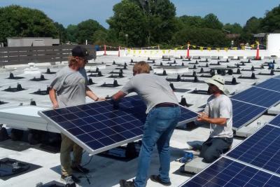 Workers install solar panels on the roof of Immaculate Conception Catholic Church in Hampton, Virginia. (Courtesy of Fr. John Grace)